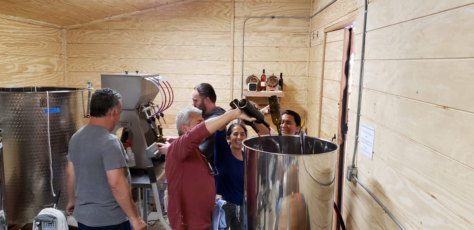 The family bottling wine together at the bodega